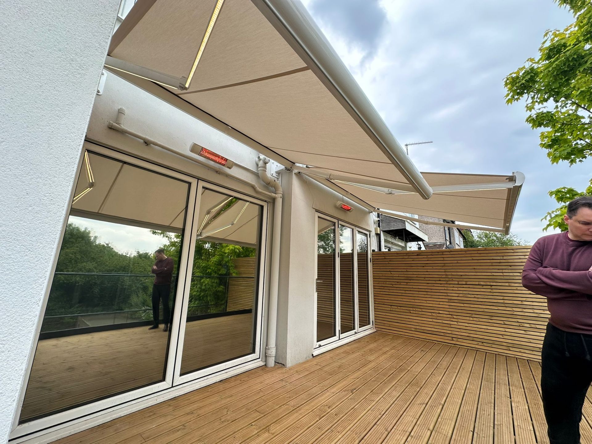 Two Aura Plus awnings extended over decked terrace with LEDs and heaters, Barnet