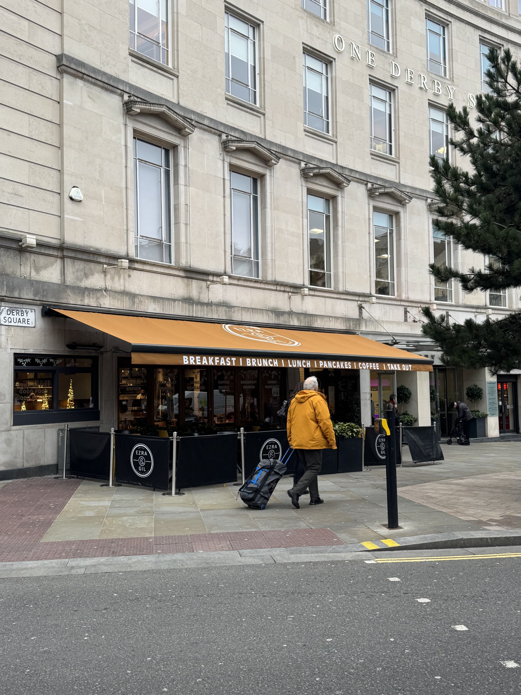 Ochre Calnova with hood over Ezra & Gil coffee shop on Derby Square, Liverpool
