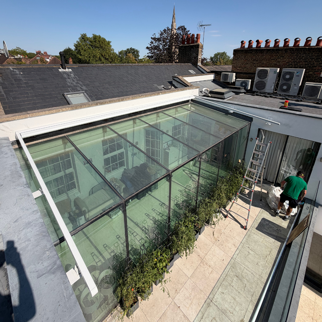 Markilux 8800 conservatory awning shading a glazed rooftop space in Highgate