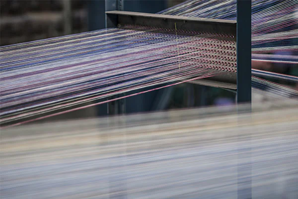 Dickson jacquard loom weaving solution-dyed acrylic fabric in Northern France