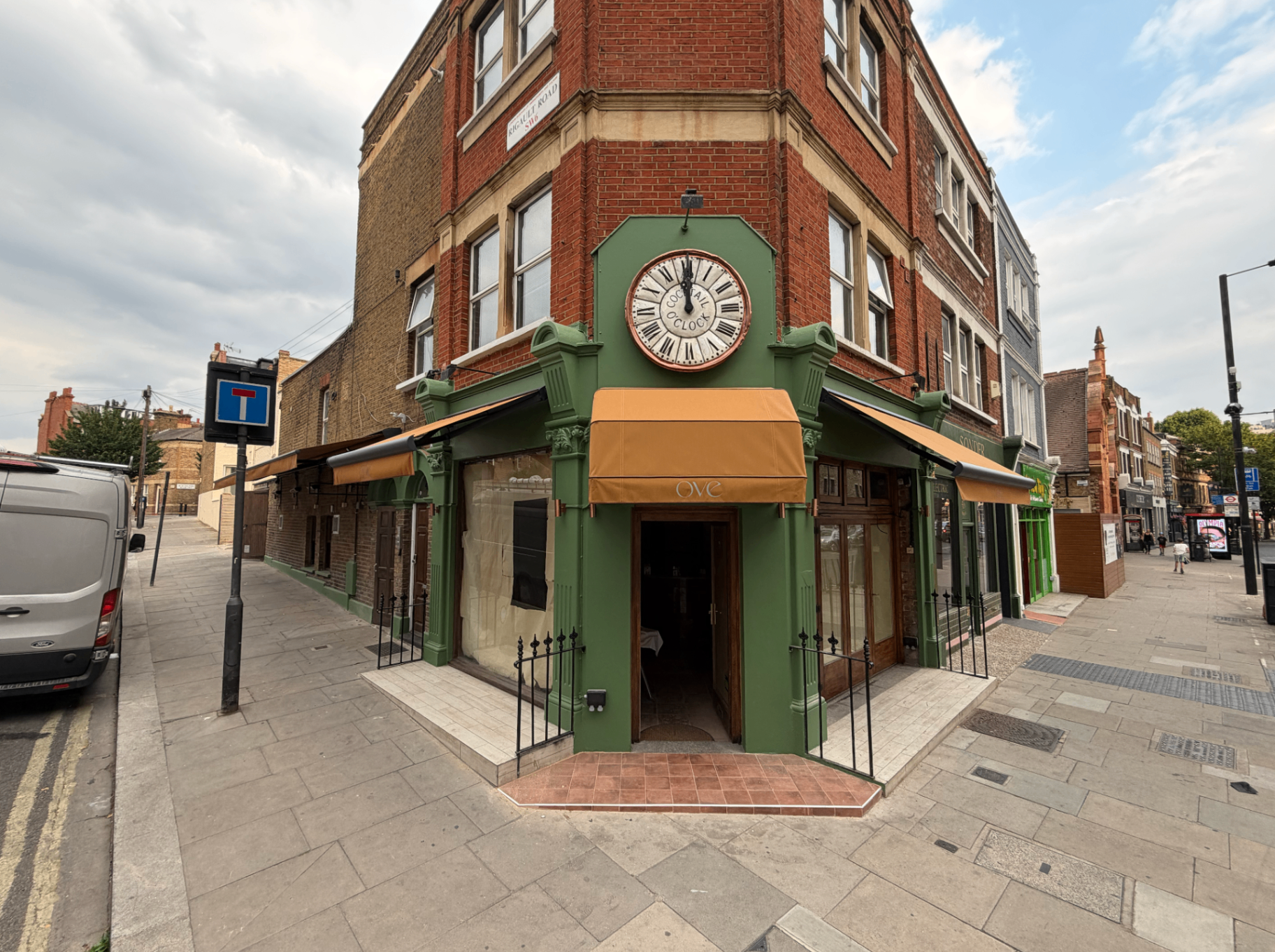 Dutch canopy over a corner shopfront entrance