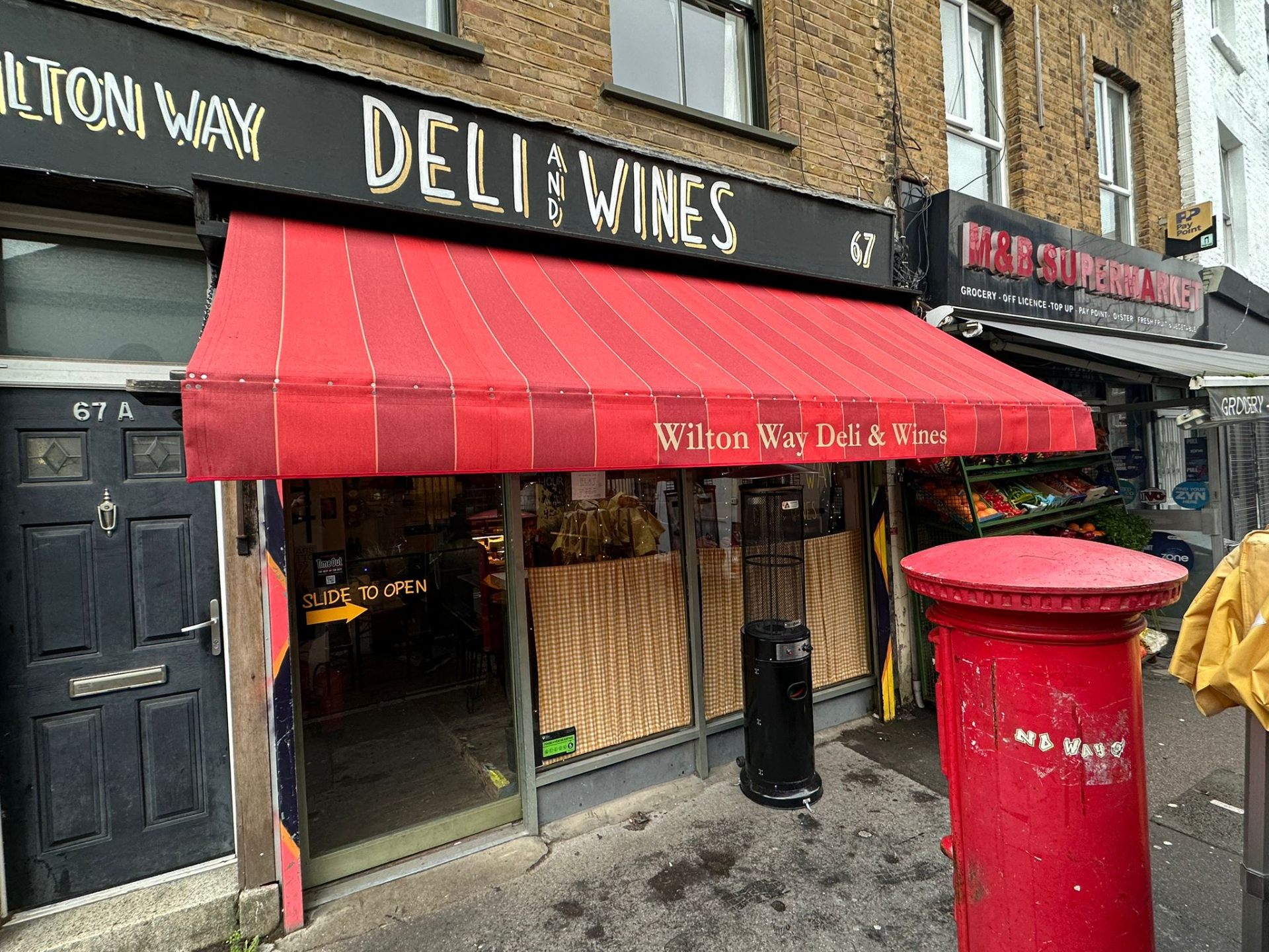 Wilton Way Deli & Wines red striped traditional awning with branded valance, Hackney