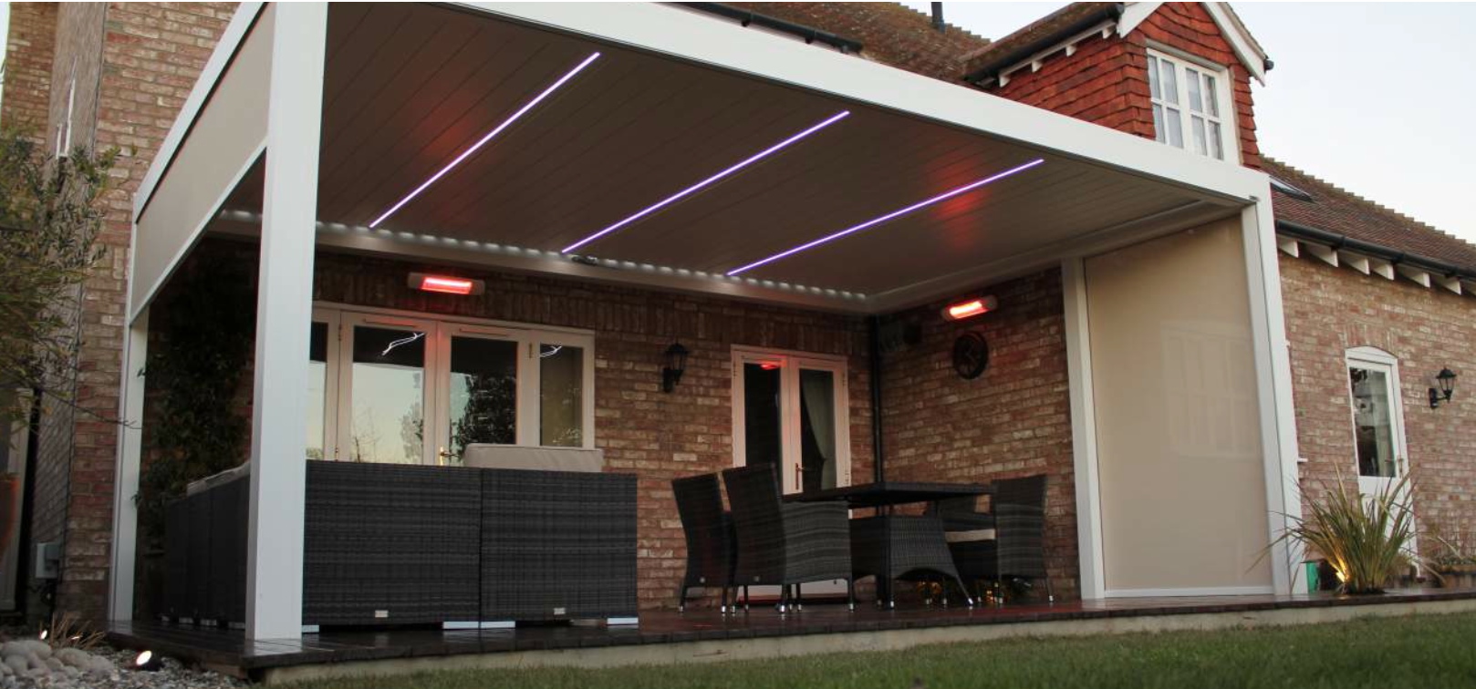 Alfresco pergola with LED strips and Tansun infrared heaters mounted to the wall