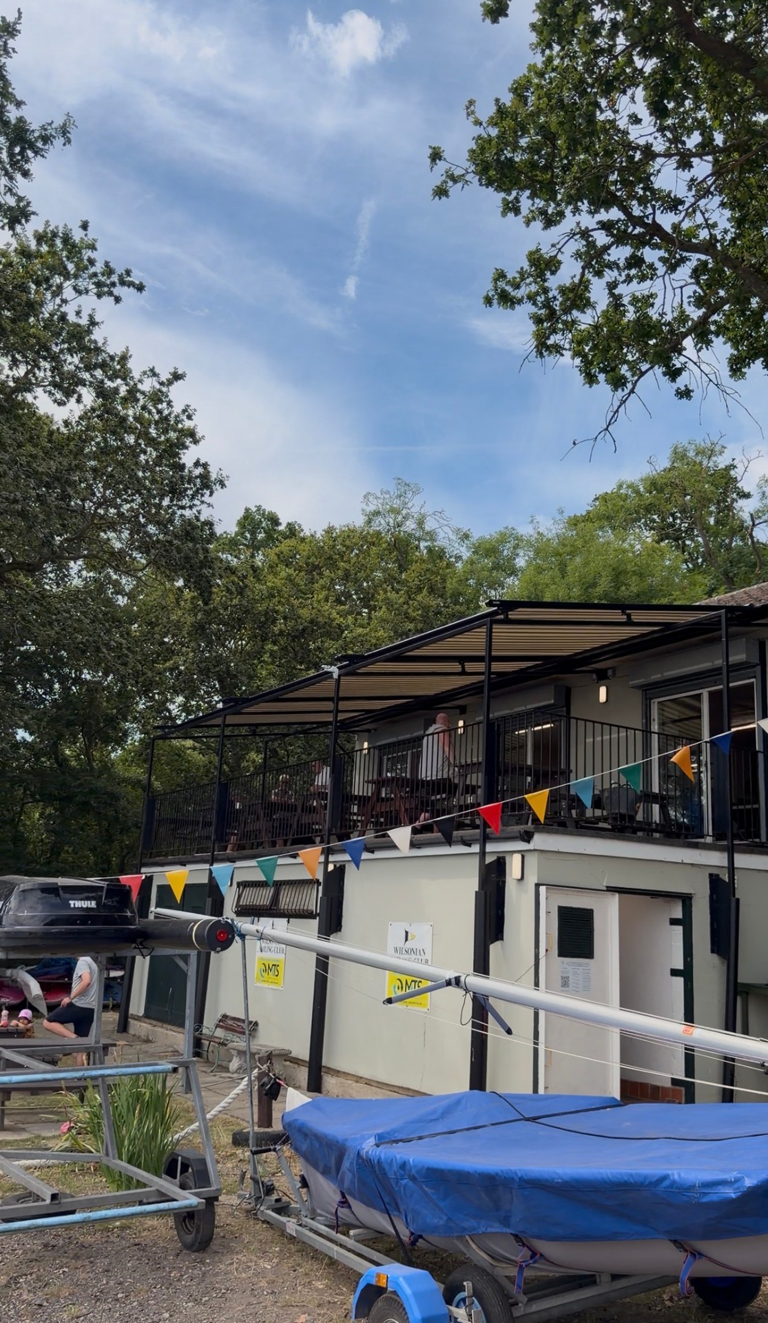 Three Markilux 8800 units extended over first-floor terrace at Rochester clubhouse